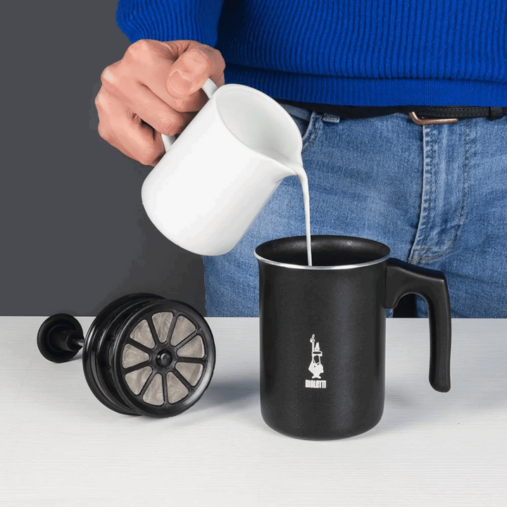 pouring milk into frother