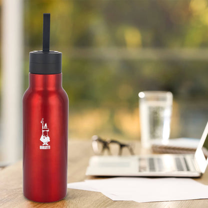 bialetti red thermal drinks bottle on table with glasses and glass of water