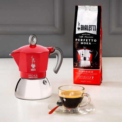 small glass coffee cup and Bialetti red moka induction